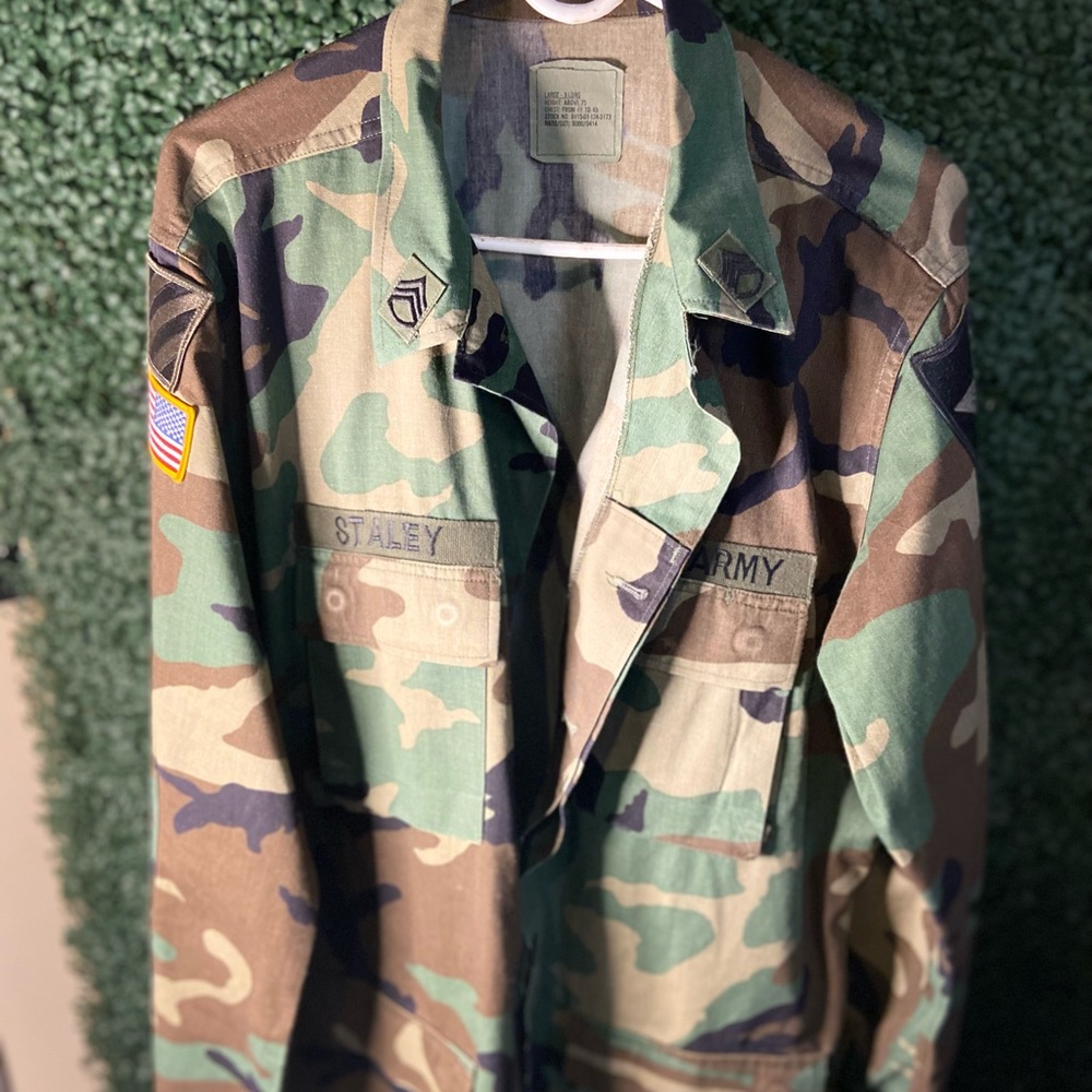 Mid army surplus jacket with patches and name tag